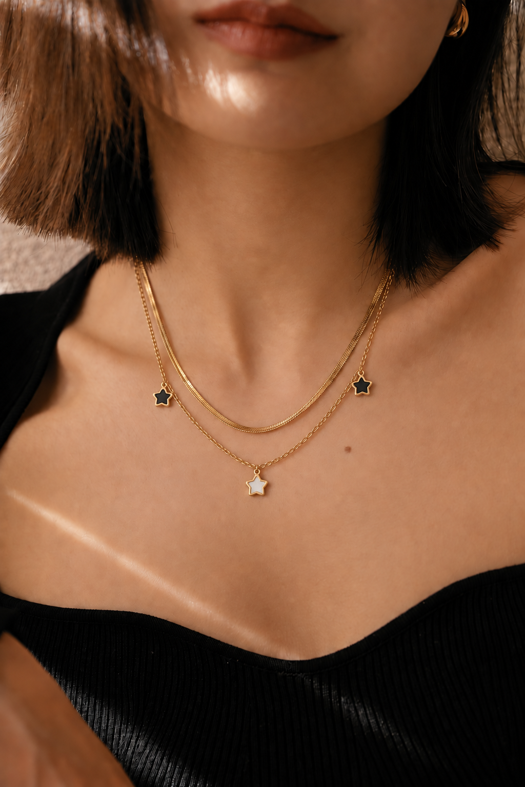 Layered star charm necklace