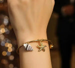 Load image into Gallery viewer, Seashell and Starfish Charm Cuff
